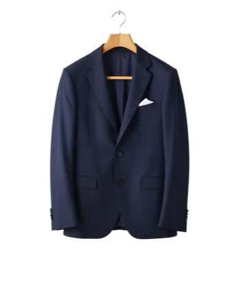 Navy suit jacket with a white pocket square on a wooden hanger