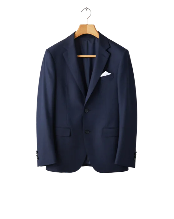 Navy suit jacket with a white pocket square on a wooden hanger